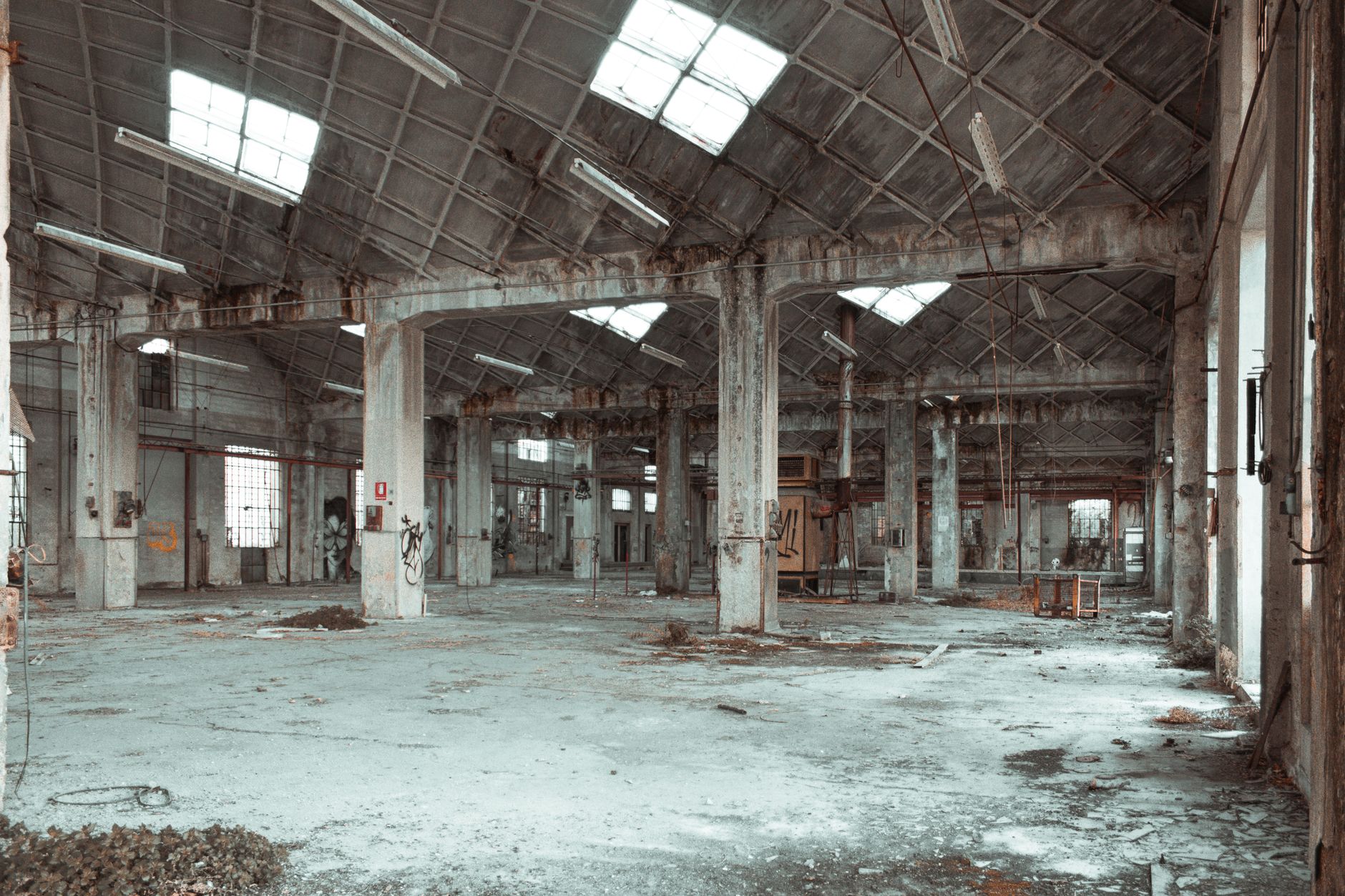 Discover the beauty of an abandoned warehouse interior with columns and derelict features.